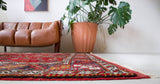 Vintage Turkish rug in a living room setting, pile rug, Turkish rug, vintage rug, portland, rug shop, bright colors, wild shaman, soft rug, bold color, Portland, Oregon, rug store, rug shop, local shop, antique rug