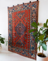 Vintage Turkish rug in a living room setting, pile rug, Turkish rug, vintage rug, portland, rug shop, bright colors, wild shaman, soft rug, bold color, Portland, Oregon, rug store, rug shop, local shop, antique rug