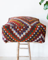 Floor pouf in a living room setting, pillow, turkish pillow, kilim pillow, home decor, decorative pillow, sham, rug pillow, decor, home decor, pouf, floor cushion, cushion, Portland, rugshop, Oregon, Wild Shaman, ottoman