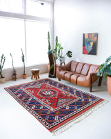 Vintage Turkish rug in a living room setting, pile rug, Turkish rug, vintage rug, portland, rug shop, bright colors, wild shaman, soft rug, bold color, Portland, Oregon, rug store, rug shop, local shop, antique rug