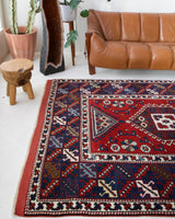 Vintage Turkish rug in a living room setting, pile rug, Turkish rug, vintage rug, portland, rug shop, bright colors, wild shaman, soft rug, bold color, Portland, Oregon, rug store, rug shop, local shop, antique rug