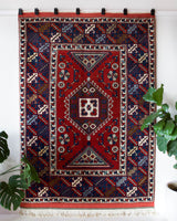 Vintage Turkish rug in a living room setting, pile rug, Turkish rug, vintage rug, portland, rug shop, bright colors, wild shaman, soft rug, bold color, Portland, Oregon, rug store, rug shop, local shop, antique rug
