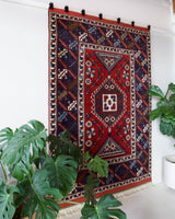 Vintage Turkish rug in a living room setting, pile rug, Turkish rug, vintage rug, portland, rug shop, bright colors, wild shaman, soft rug, bold color, Portland, Oregon, rug store, rug shop, local shop, antique rug