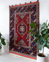 Vintage Turkish rug in a living room setting, pile rug, Turkish rug, vintage rug, portland, rug shop, bright colors, wild shaman, soft rug, bold color, Portland, Oregon, rug store, rug shop, local shop, antique rug