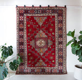 Vintage Turkish rug in a living room setting, pile rug, Turkish rug, vintage rug, portland, rug shop, bright colors, wild shaman, soft rug, bold color, Portland, Oregon, rug store, rug shop, local shop, antique rug