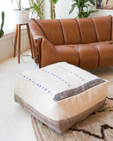 Floor pouf in a living room setting, pillow, turkish pillow, kilim pillow, home decor, decorative pillow, sham, rug pillow, decor, home decor, pouf, floor cushion, cushion, Portland, rugshop, Oregon, Wild Shaman, ottoman