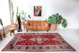 Vintage Turkish rug in a living room setting, pile rug, Turkish rug, vintage rug, portland, rug shop, bright colors, wild shaman, soft rug, bold color, Portland, Oregon, rug store, rug shop, local shop, antique rug