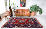 Vintage Turkish rug in a living room setting, pile rug, Turkish rug, vintage rug, portland, rug shop, bright colors, wild shaman, soft rug, bold color, Portland, Oregon, rug store, rug shop, local shop, antique rug,