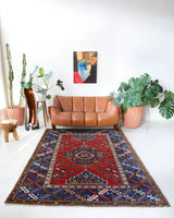 Vintage Turkish rug in a living room setting, pile rug, Turkish rug, vintage rug, portland, rug shop, bright colors, wild shaman, soft rug, bold color, Portland, Oregon, rug store, rug shop, local shop, antique rug,
