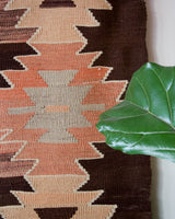 Vintage kilim rug in living room setting, old rug, antique rug, pastel colors, faded colors, Turkish rug, vintage rug, soft rug, Portland, Oregon, rug store, rug shop, local shop, earthy tones, earthy colors, warm colors