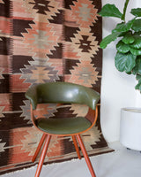 Vintage kilim rug in living room setting, old rug, antique rug, pastel colors, faded colors, Turkish rug, vintage rug, soft rug, Portland, Oregon, rug store, rug shop, local shop, earthy tones, earthy colors, warm colors