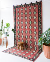 Vintage kilim rug in living room setting, old rug, antique rug, pastel colors, faded colors, Turkish rug, vintage rug, soft rug, Portland, Oregon, rug store, rug shop, local shop, earthy tones, earthy colors