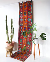 Vintage Turkish runner rug in a living room setting, pile rug, Turkish rug, vintage rug, portland, rug shop, bright colors, wild shaman, soft rug, bold color, Portland, Oregon, rug store, rug shop, local shop, antique rug