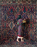 Antique Persian area rug in a living room setting, pile rug, vintage rug, portland, rug shop, bright colors, wild shaman, soft rug, bold color, Portland, Oregon, rug store, rug shop, local shop, antique rug, Persian rug, handmade rug, wool rug