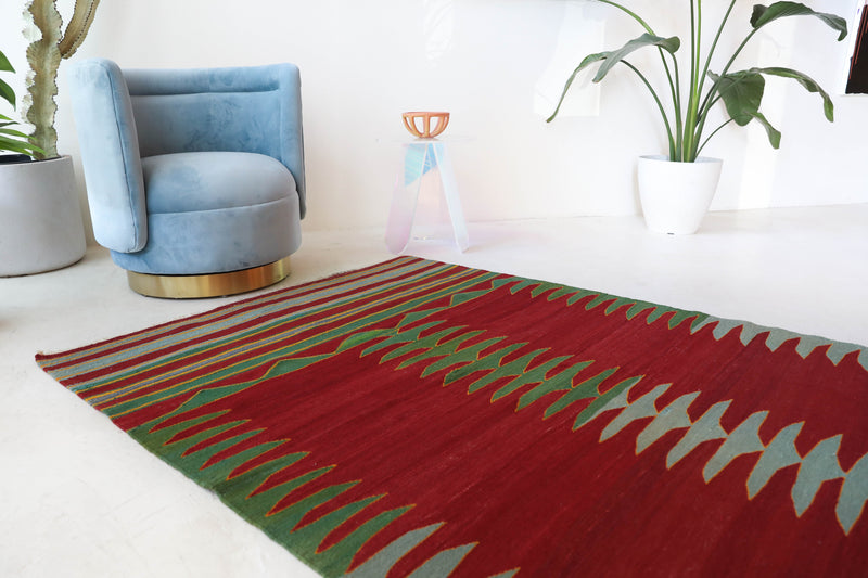 Vintage kilim rug in living room setting, bright colors, wild shaman, soft rug, bold color, Portland, Oregon, rug store, rug shop, local shop, vintage rug, modern kilim, warm colors, antique kilim rug