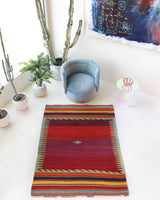 Vintage kilim rug in living room setting, bright colors, wild shaman, soft rug, bold color, Portland, Oregon, rug store, rug shop, local shop, vintage rug, modern kilim, warm colors, antique rug, antique kilim