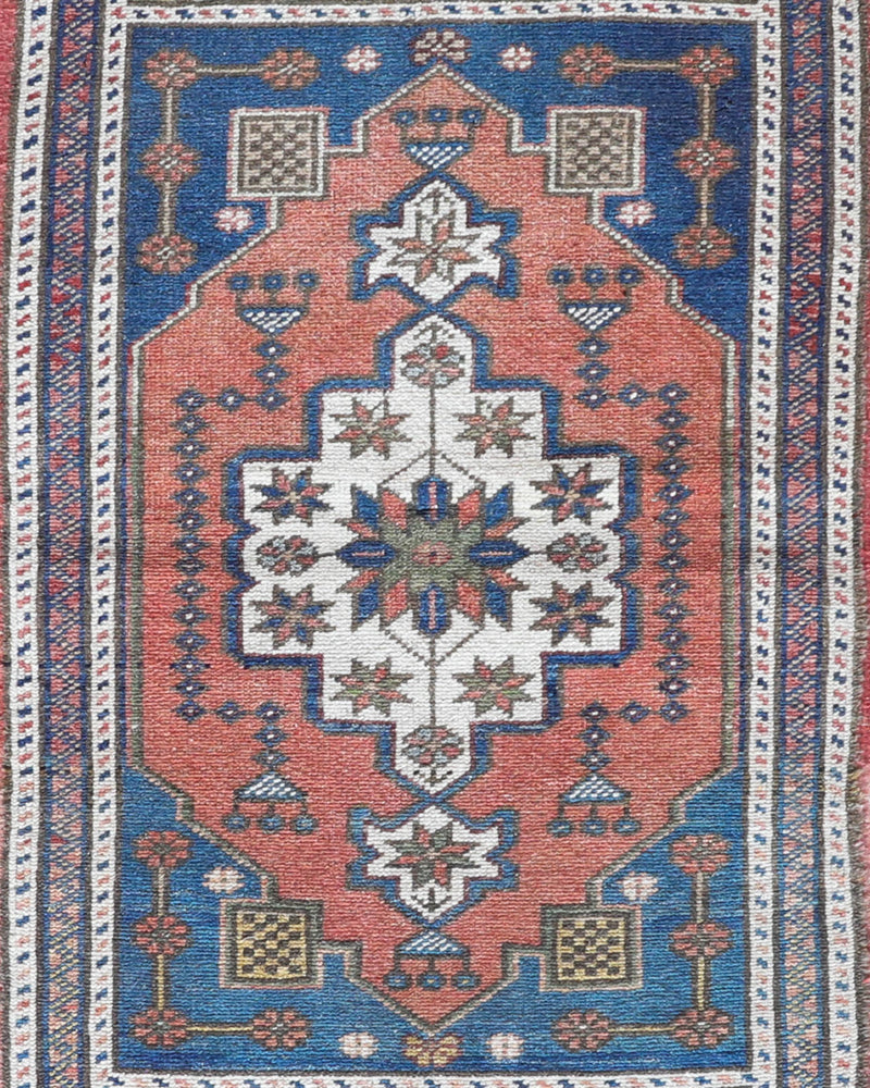 Vintage Turkish mini rug in room decor setting, old rug, antique rug, pastel colors, faded colors, Turkish rug, vintage rug, soft rug, Portland, Oregon, rug store, rug shop, local shop,  bright colors, bold colors