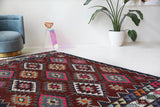Vintage kilim rug in living room setting, bright colors, wild shaman, soft rug, bold color, Portland, Oregon, rug store, rug shop, local shop, vintage rug, modern kilim, warm colors, antique rug, antique kilim