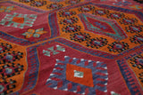 Vintage kilim rug in living room setting, bright colors, wild shaman, soft rug, bold color, Portland, Oregon, rug store, rug shop, local shop, vintage rug, modern kilim, warm colors, antique rug, antique kilim