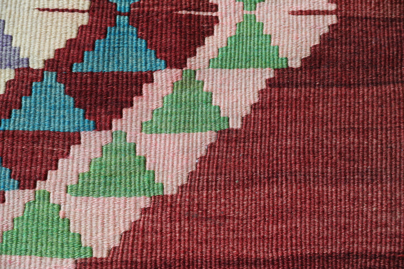  Vintage kilim rug in living room setting, old rug, antique rug, pastel colors, faded colors, Turkish rug, vintage rug, soft rug, Portland, Oregon, rug store, rug shop, local shop, earthy tones, earthy colors, warm colors