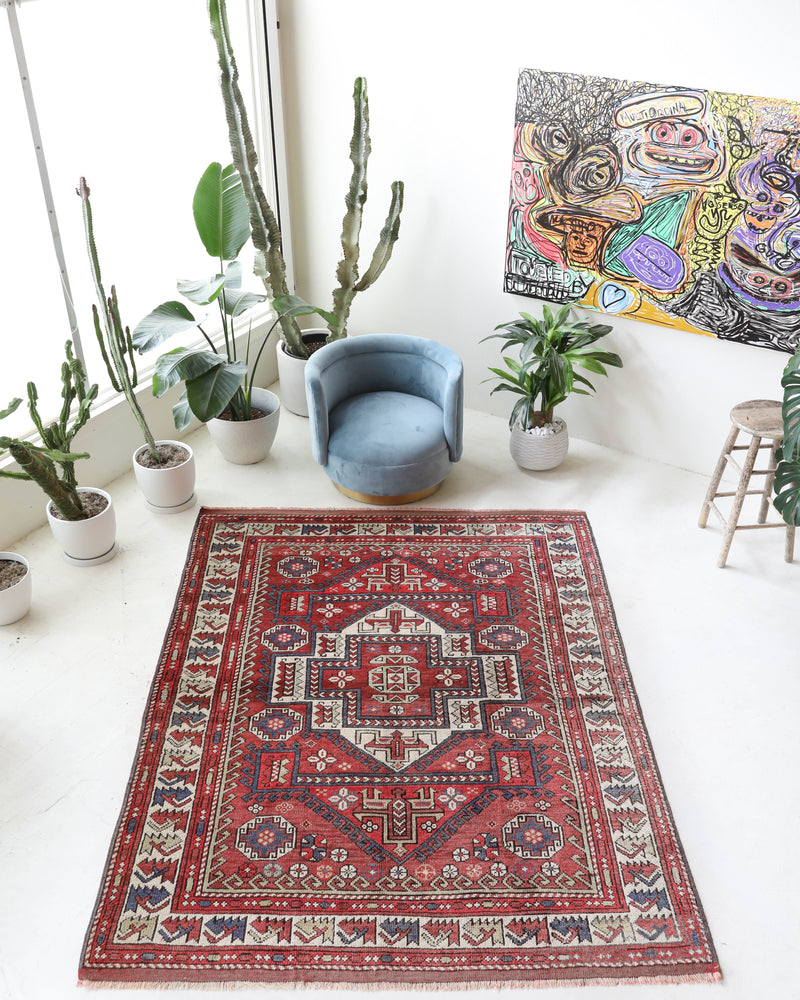 Vintage kilim rug in living room setting, old rug, antique rug, pastel colors, faded colors, Turkish rug, vintage rug, soft rug, Portland, Oregon, rug store, rug shop, local shop, earthy tones, earthy colors, warm colors