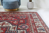 Vintage kilim rug in living room setting, old rug, antique rug, pastel colors, faded colors, Turkish rug, vintage rug, soft rug, Portland, Oregon, rug store, rug shop, local shop, earthy tones, earthy colors, warm colors