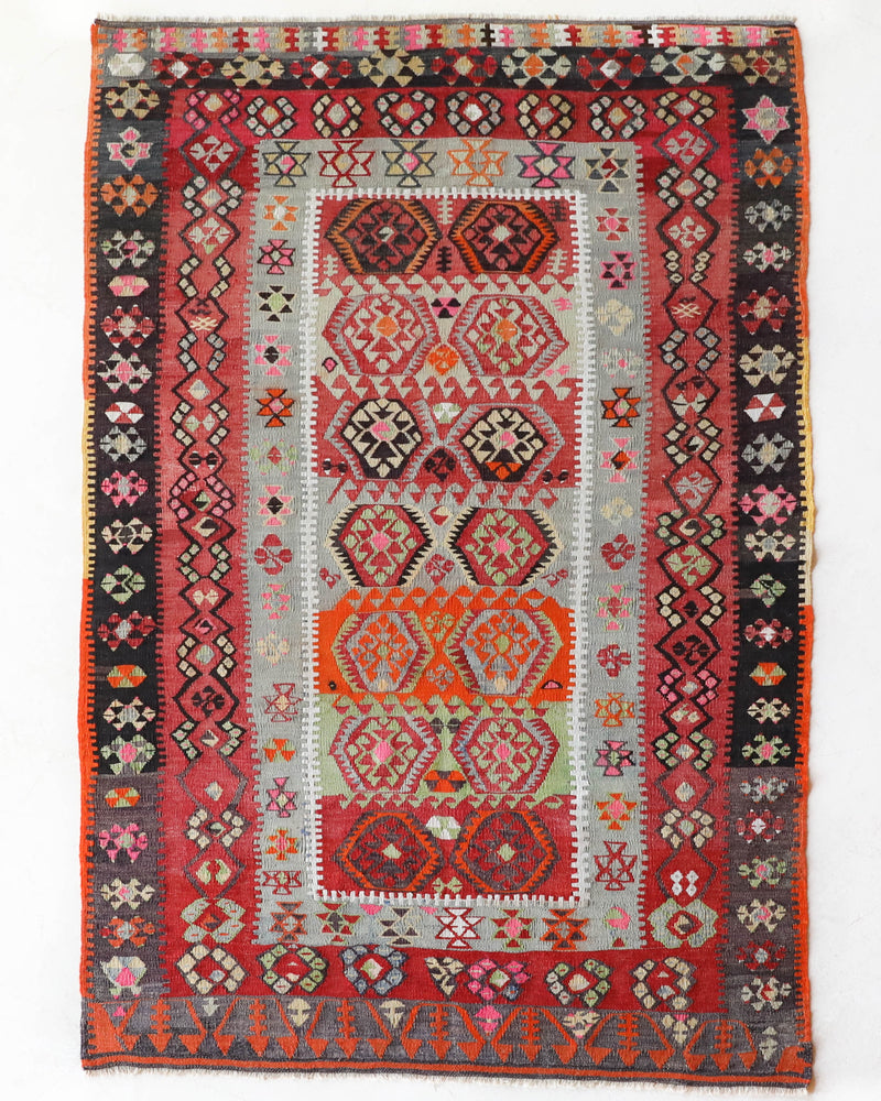 Vintage kilim rug in room decor setting, old rug, antique rug, pastel colors, faded colors, Turkish rug, vintage rug, soft rug, Portland, Oregon, rug store, rug shop, local shop,  antique kilim rug, bold colors, bright colors, faded colors