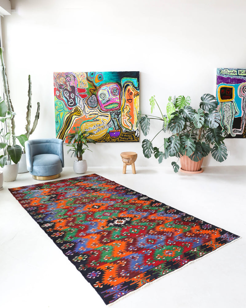 Vintage kilim rug in living room setting, bright colors, wild shaman, soft rug, bold color, Portland, Oregon, rug store, rug shop, local shop, vintage rug, modern kilim, warm colors, antique kilim rug