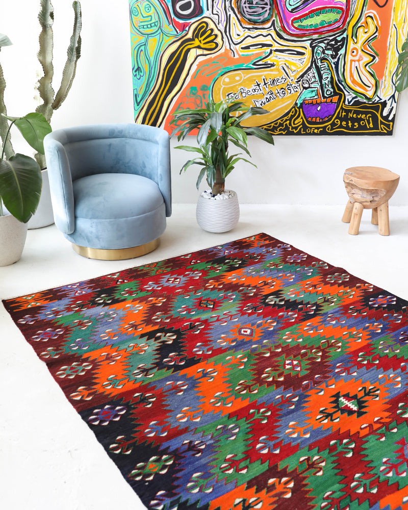 Vintage kilim rug in living room setting, bright colors, wild shaman, soft rug, bold color, Portland, Oregon, rug store, rug shop, local shop, vintage rug, modern kilim, warm colors, antique kilim rug