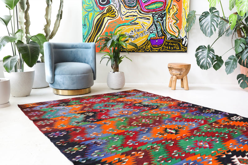 Vintage kilim rug in living room setting, bright colors, wild shaman, soft rug, bold color, Portland, Oregon, rug store, rug shop, local shop, vintage rug, modern kilim, warm colors, antique kilim rug