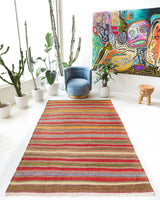 Vintage kilim rug in living room setting, old rug, antique rug, pastel colors, faded colors, Turkish rug, vintage rug, soft rug, Portland, Oregon, rug store, rug shop, local shop, earthy tones, earthy colors, warm colors