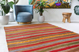 Vintage kilim rug in living room setting, old rug, antique rug, pastel colors, faded colors, Turkish rug, vintage rug, soft rug, Portland, Oregon, rug store, rug shop, local shop, earthy tones, earthy colors, warm colors