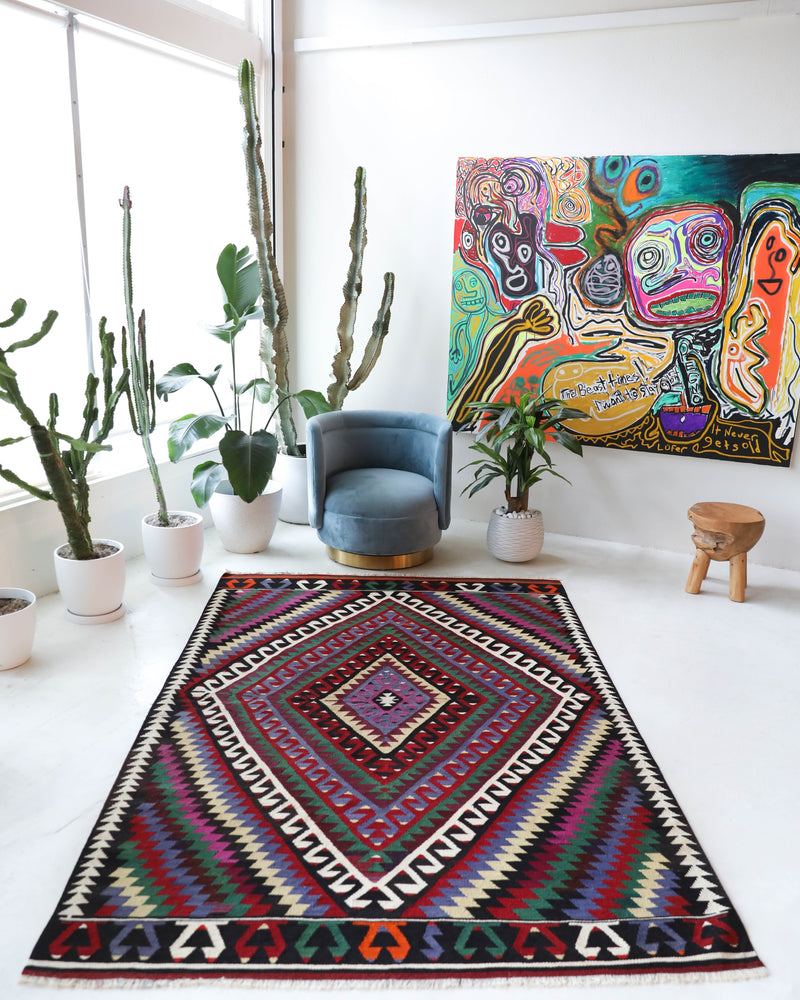 Vintage kilim rug in living room setting, bright colors, wild shaman, soft rug, bold color, Portland, Oregon, rug store, rug shop, local shop, vintage rug, modern kilim, warm colors, antique kilim rug