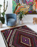 Vintage kilim rug in living room setting, bright colors, wild shaman, soft rug, bold color, Portland, Oregon, rug store, rug shop, local shop, vintage rug, modern kilim, warm colors, antique kilim rug