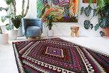 Vintage kilim rug in living room setting, bright colors, wild shaman, soft rug, bold color, Portland, Oregon, rug store, rug shop, local shop, vintage rug, modern kilim, warm colors, antique kilim rug