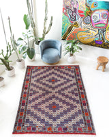 Vintage kilim rug in living room setting, bright colors, wild shaman, soft rug, bold color, Portland, Oregon, rug store, rug shop, local shop, vintage rug, modern kilim, warm colors, antique kilim rug