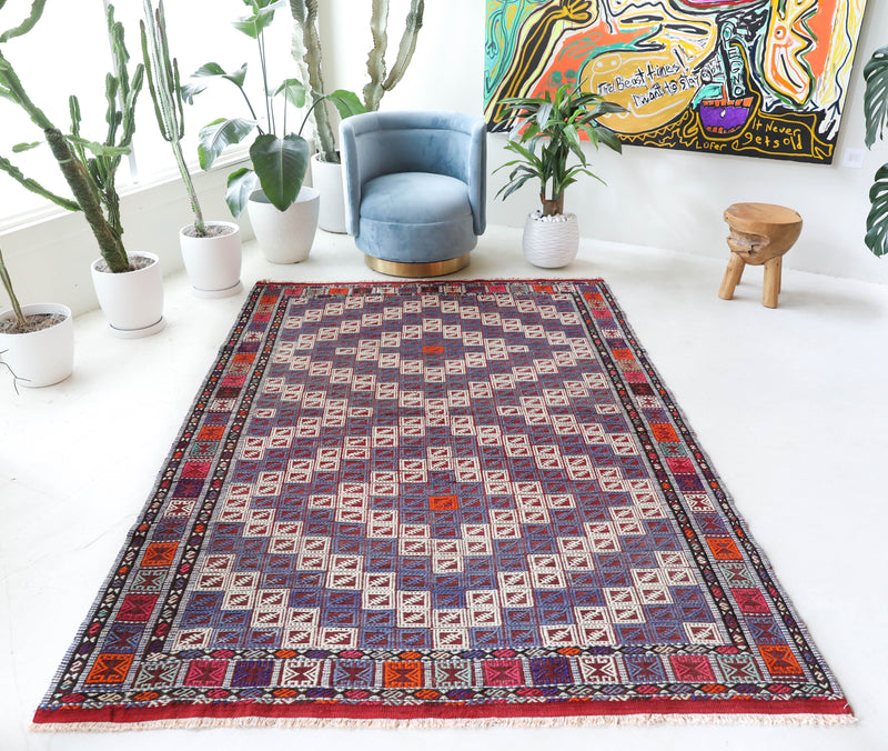 Vintage kilim rug in living room setting, bright colors, wild shaman, soft rug, bold color, Portland, Oregon, rug store, rug shop, local shop, vintage rug, modern kilim, warm colors, antique kilim rug