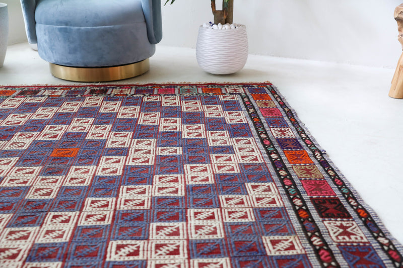 Vintage kilim rug in living room setting, bright colors, wild shaman, soft rug, bold color, Portland, Oregon, rug store, rug shop, local shop, vintage rug, modern kilim, warm colors, antique kilim rug