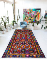 Vintage kilim rug in living room setting, bright colors, wild shaman, soft rug, bold color, Portland, Oregon, rug store, rug shop, local shop, vintage rug, modern kilim, warm colors, antique kilim rug