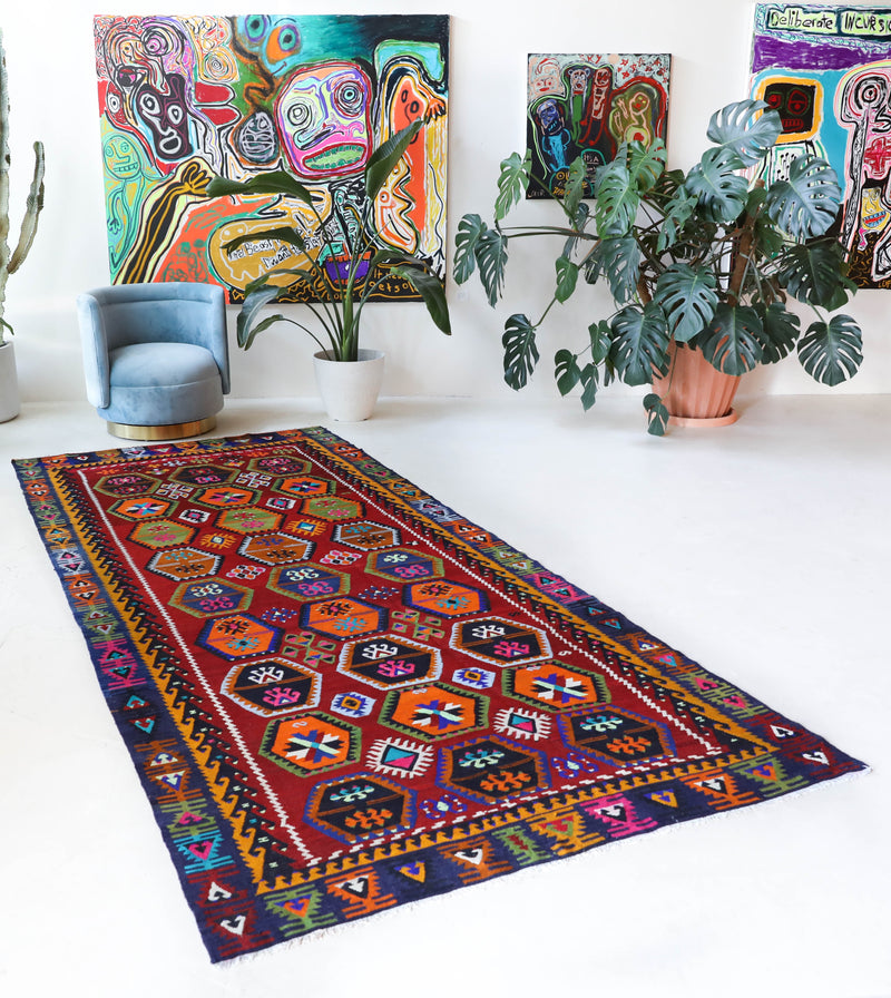 Vintage kilim rug in living room setting, bright colors, wild shaman, soft rug, bold color, Portland, Oregon, rug store, rug shop, local shop, vintage rug, modern kilim, warm colors, antique kilim rug