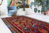 Vintage kilim rug in living room setting, bright colors, wild shaman, soft rug, bold color, Portland, Oregon, rug store, rug shop, local shop, vintage rug, modern kilim, warm colors, antique kilim rug