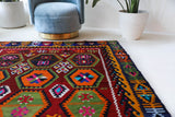 Vintage kilim rug in living room setting, bright colors, wild shaman, soft rug, bold color, Portland, Oregon, rug store, rug shop, local shop, vintage rug, modern kilim, warm colors, antique kilim rug