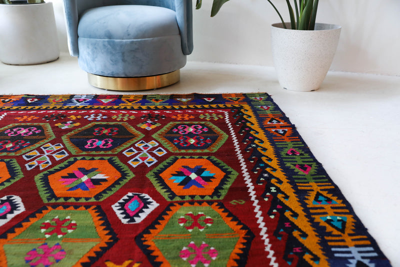 Vintage kilim rug in living room setting, bright colors, wild shaman, soft rug, bold color, Portland, Oregon, rug store, rug shop, local shop, vintage rug, modern kilim, warm colors, antique kilim rug