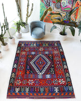 Vintage kilim rug in living room setting, bright colors, wild shaman, soft rug, bold color, Portland, Oregon, rug store, rug shop, local shop, vintage rug, modern kilim, warm colors, antique kilim rug