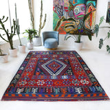 Vintage kilim rug in living room setting, bright colors, wild shaman, soft rug, bold color, Portland, Oregon, rug store, rug shop, local shop, vintage rug, modern kilim, warm colors, antique kilim rug