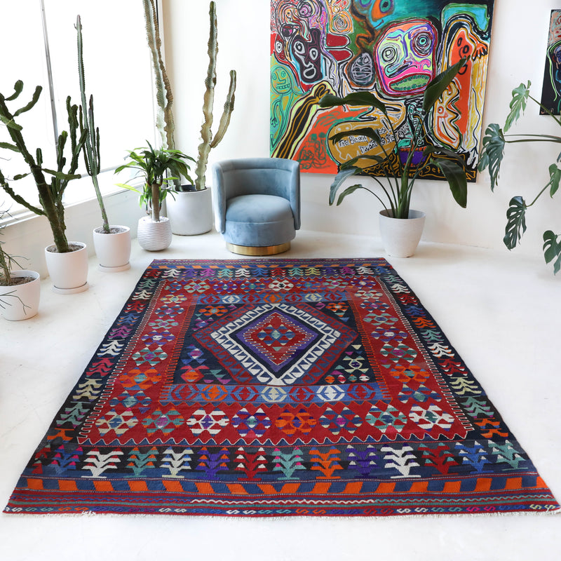 Vintage kilim rug in living room setting, bright colors, wild shaman, soft rug, bold color, Portland, Oregon, rug store, rug shop, local shop, vintage rug, modern kilim, warm colors, antique kilim rug