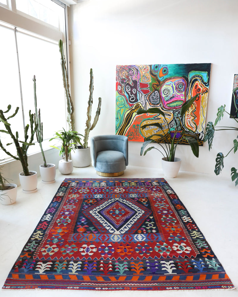 Vintage kilim rug in living room setting, bright colors, wild shaman, soft rug, bold color, Portland, Oregon, rug store, rug shop, local shop, vintage rug, modern kilim, warm colors, antique kilim rug