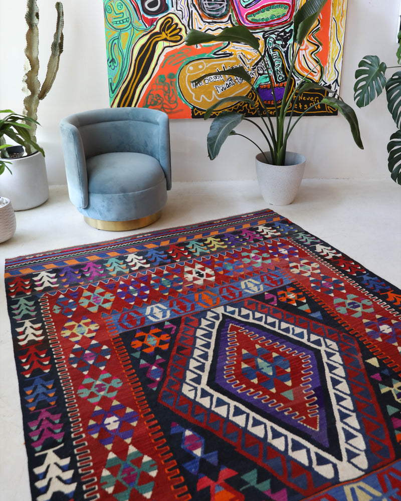 Vintage kilim rug in living room setting, bright colors, wild shaman, soft rug, bold color, Portland, Oregon, rug store, rug shop, local shop, vintage rug, modern kilim, warm colors, antique kilim rug