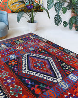 Vintage kilim rug in living room setting, bright colors, wild shaman, soft rug, bold color, Portland, Oregon, rug store, rug shop, local shop, vintage rug, modern kilim, warm colors, antique kilim rug