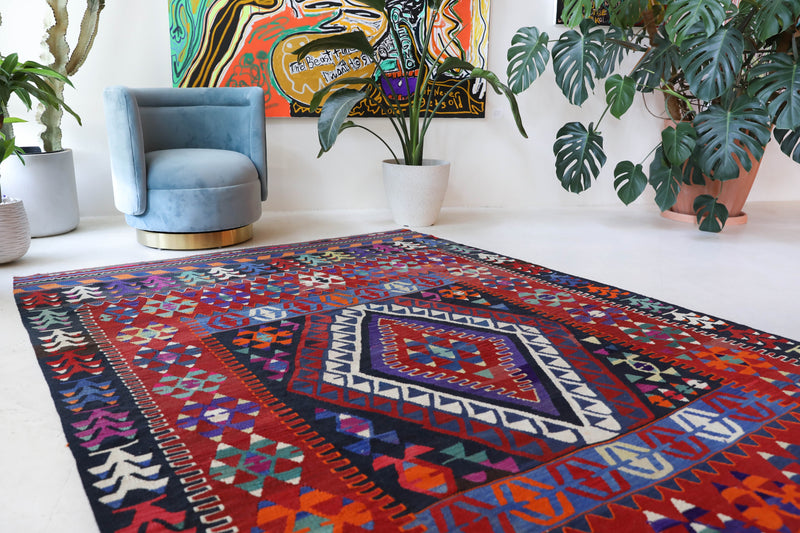 Vintage kilim rug in living room setting, bright colors, wild shaman, soft rug, bold color, Portland, Oregon, rug store, rug shop, local shop, vintage rug, modern kilim, warm colors, antique kilim rug